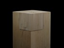 Photograph of bass wood cube model on basewith shifted portions of the cube.