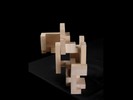 Photograph of bass wood cube model with shifted portions of the cube.