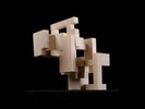 Photograph of bass wood cube model with shifted portions of the cube.