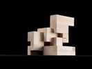 Photograph of bass wood cube model with shifted portions of the cube.