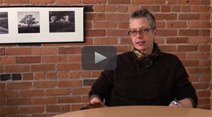 An image of instructor Janet Rankin taken from an interview in which she is seated behind a round table.