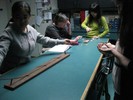 Photo of a student working with a ball on a ramp with multiple hills.