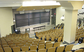 A large lecture hall with tiered seats.