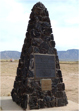 A large triangular structure made of jagged stone rests on an empty plain.