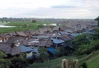 A photo of a cluster of floating homes that are built on a flood plain in Peru.