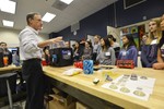 Girls are touring a 3D printing laboratory.